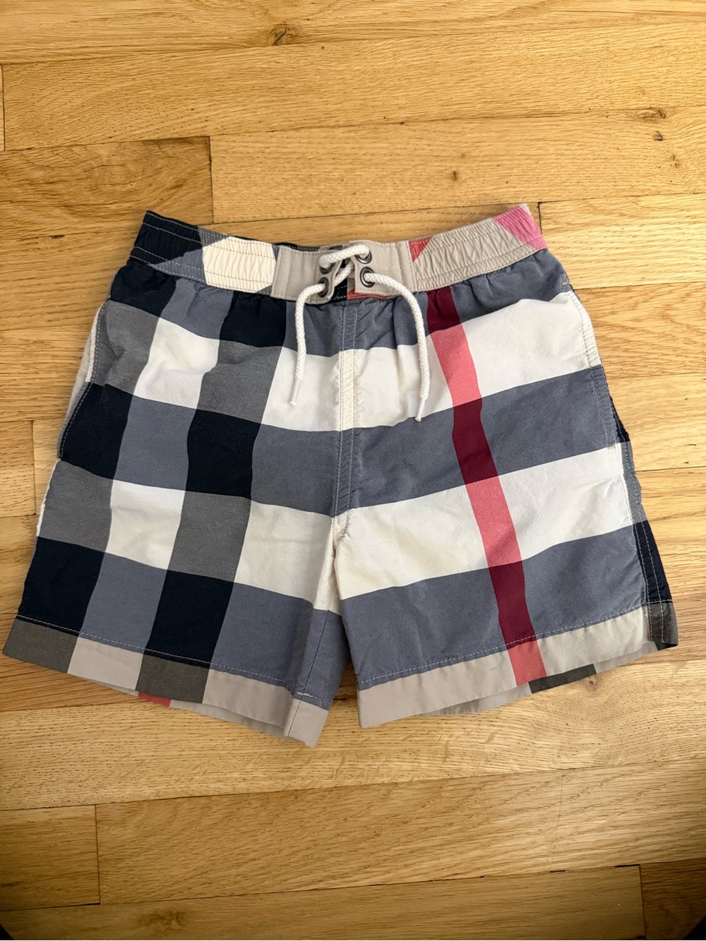 Burberry Kids Plaid Swim Trunks in Black, Cream, and Red